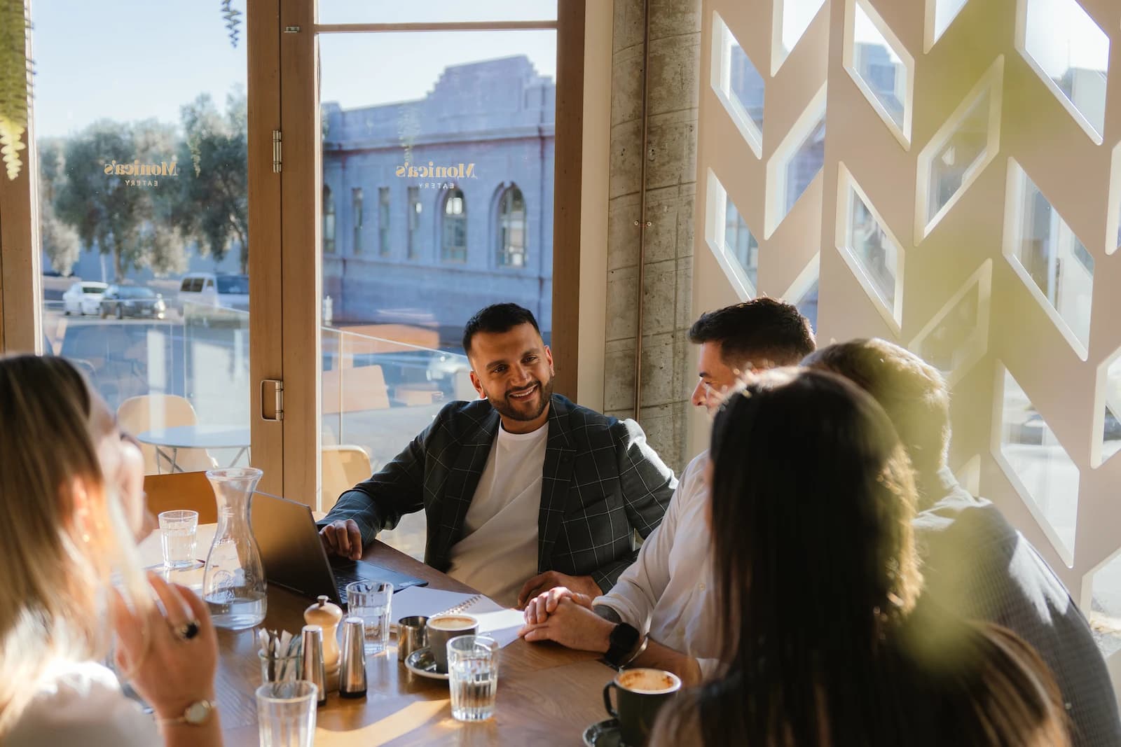 Jason Bruce in his modern office environment, experienced mortgage adviser helping Kiwis navigate their home loan journey with expert guidance